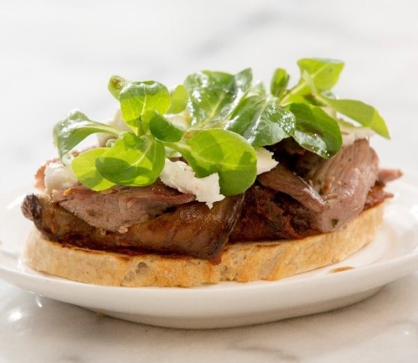 Black garlic aioli, braised eggplant, and lamb leg on bruschetta