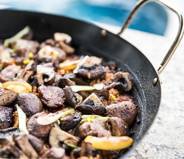 Roasted lamb shoulder paella with mushrooms, aleppo pepper and za'atar