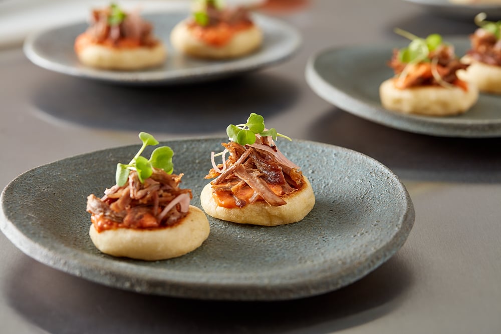 Lamb Pita with Harissa Aioli, Pickled Shallot and Roasted Garlic, Bitter Micro Greens