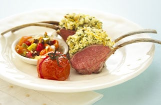 Parmesan lemon and herb crusted rack of lamb with olive muffuletta and roasted roma tomatoes