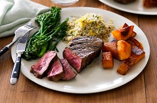 Charred Aussie beef sirloin, pumpkin, broccolini and herb couscous