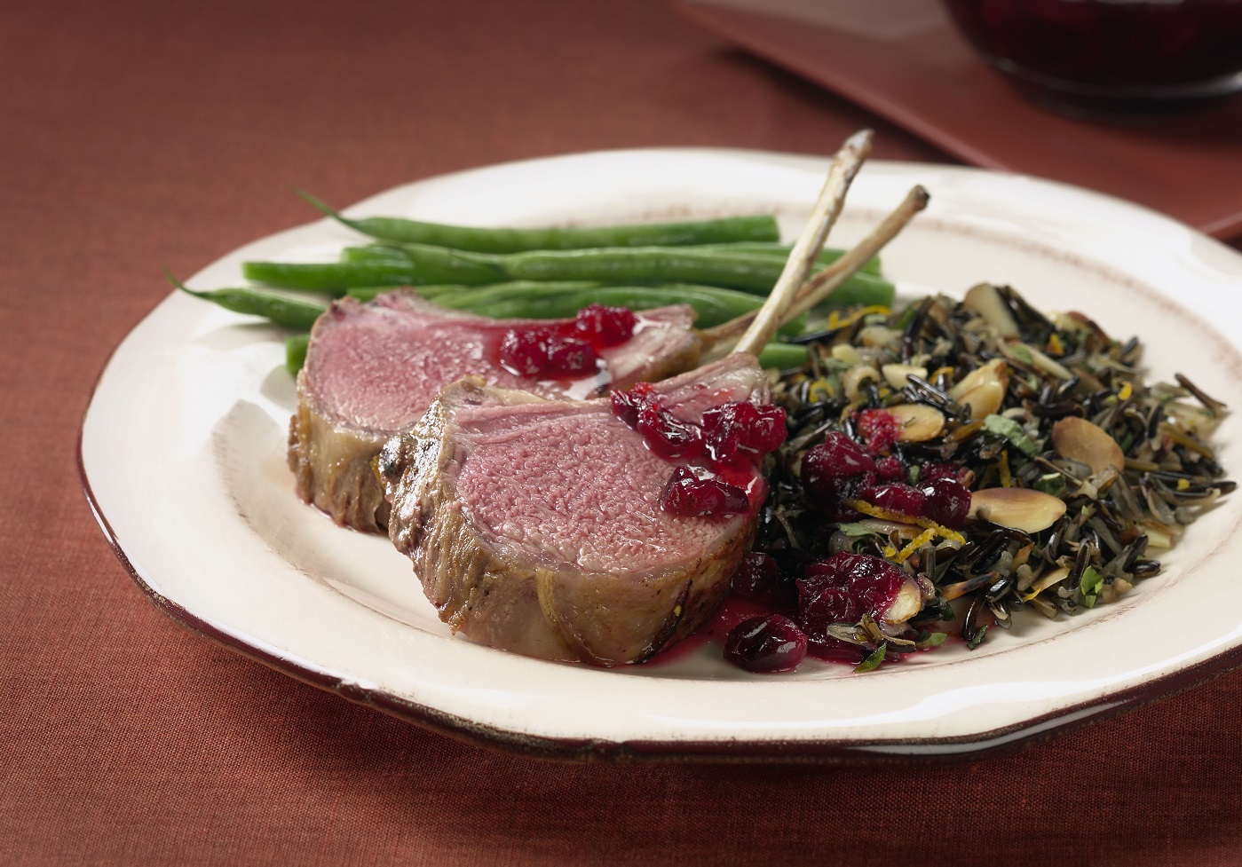 CRANBERRY-MARINATED RACK OF AUSTRALIAN LAMB WITH ALMOND WILD RICE
