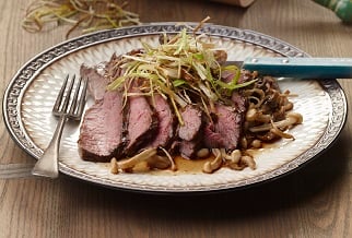 Grilled grassfed skirt steak with warm mushroom salad
