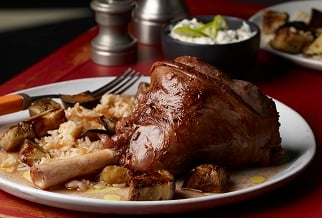 Mediterranean-style lamb shanks with pomegranate and roasted eggplant